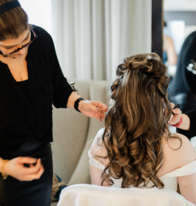Hair dresser and expert Ayda Ghaffari styles a bride's hair on her weddng day.